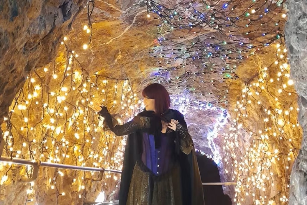 A witch walking through Wookey Hole