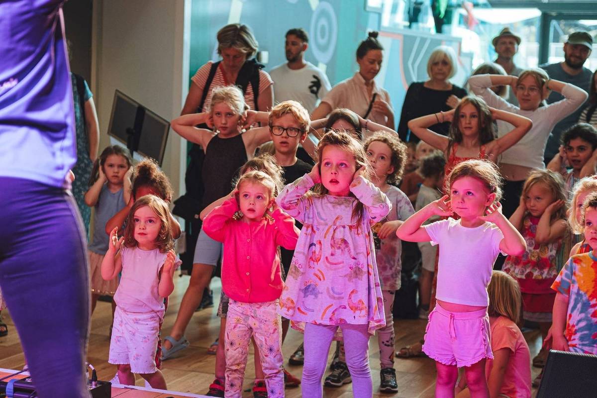 Children watching a performance at Hoo-Ha! Festival