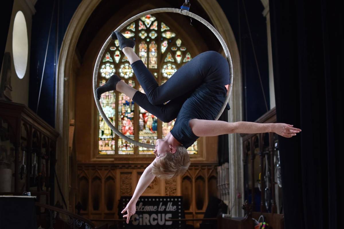 A Circomedia circus performer in a hoop in Bristol