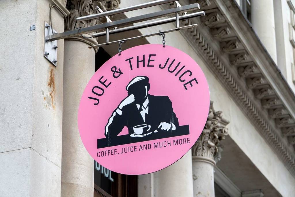 A sign for Joe & The Juice coffee shop and juice ba