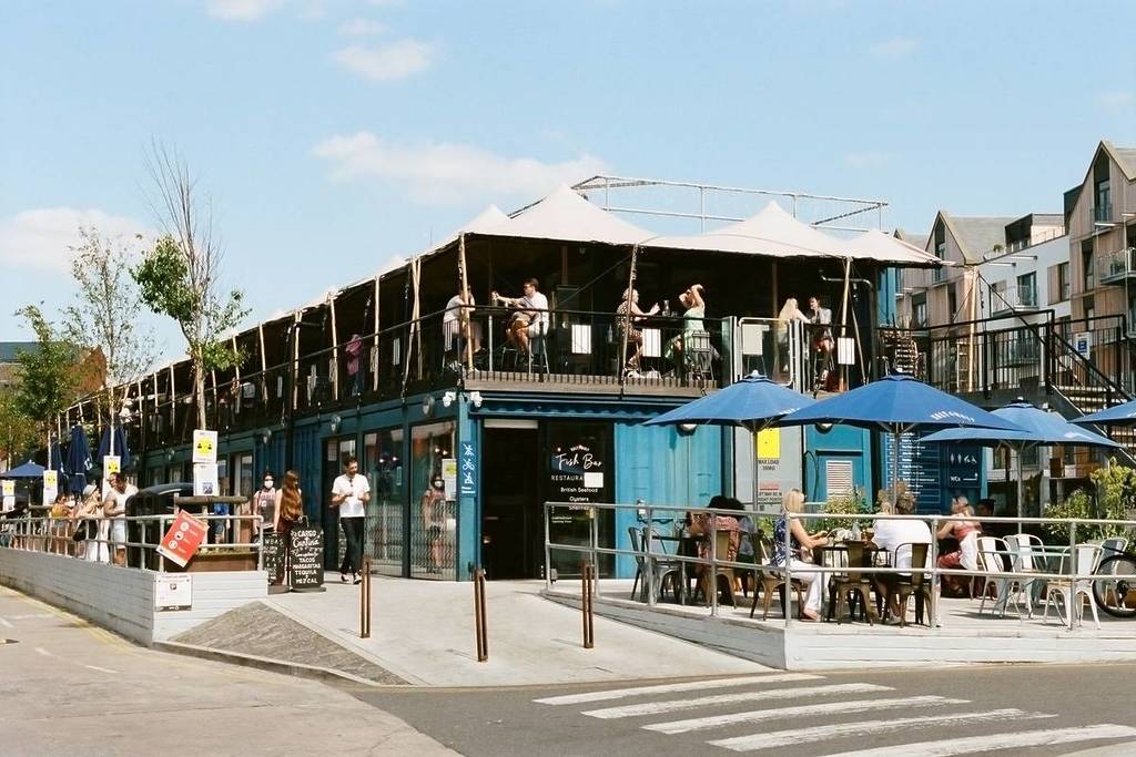 people eating outside on the harbourside in Bristol