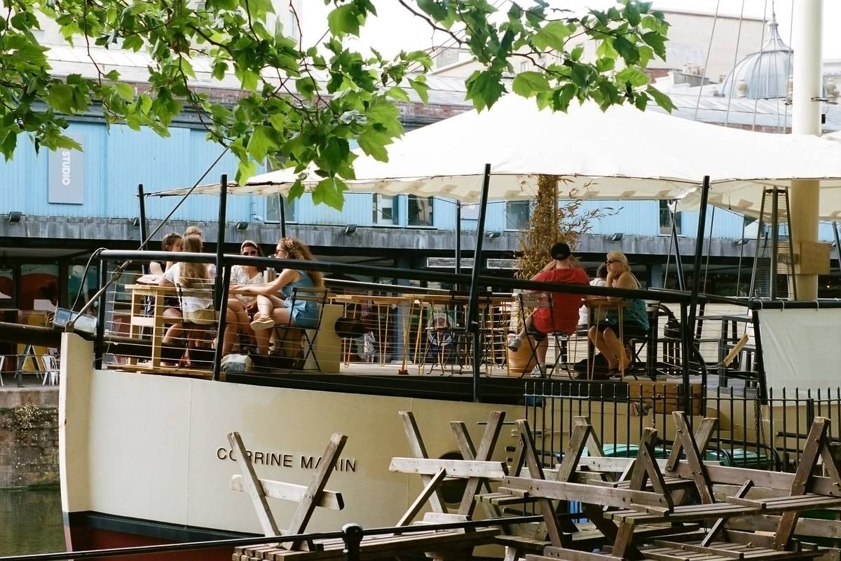 People on a boat in the sunshine in Bristol