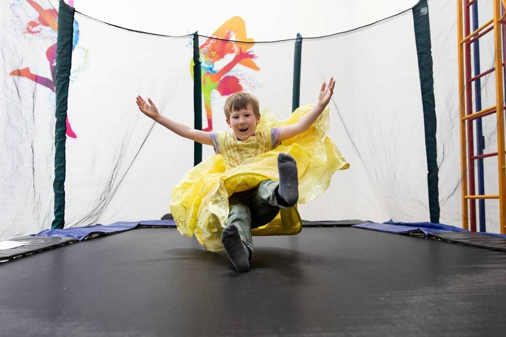 A disabled child on a trampoline at Gympanzees