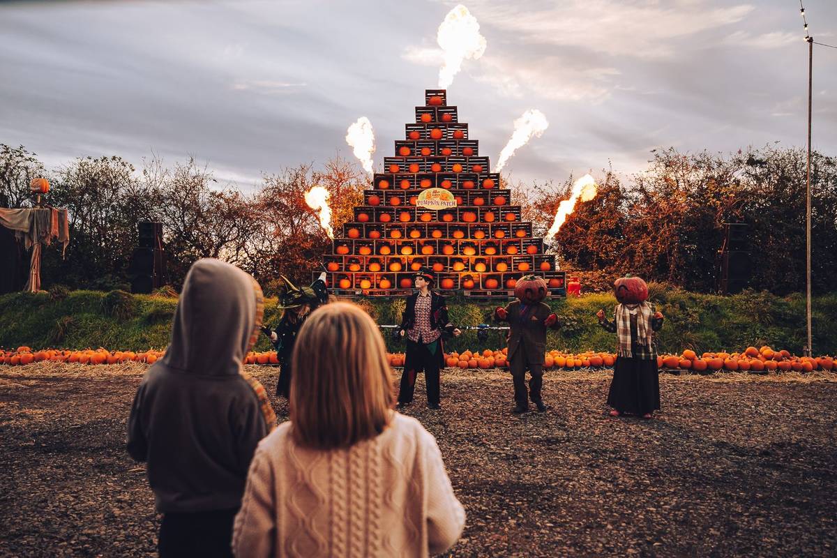 A pyramid of pumpkins shooting out flames