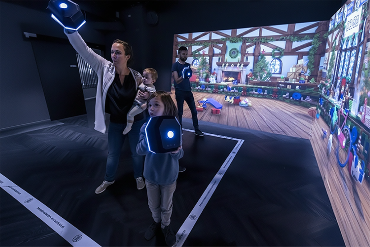 family playing at the Enchanted Christmas experience