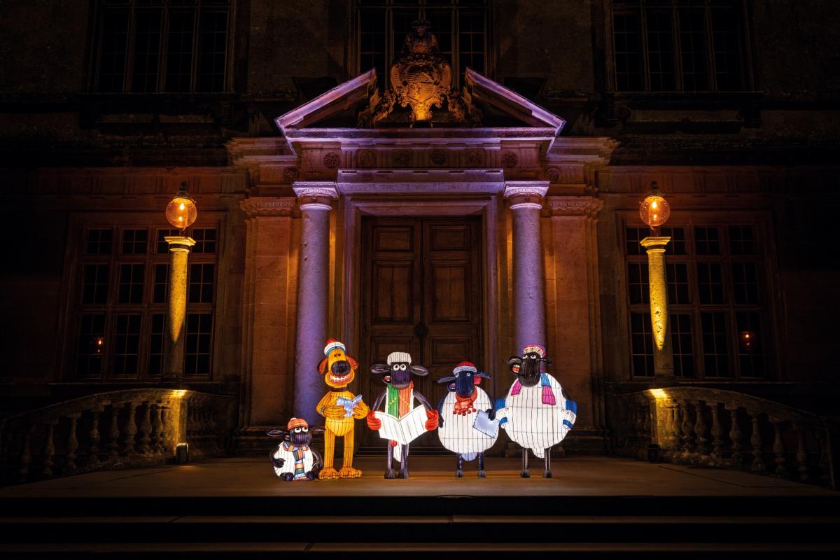 Aardman characters carol singing, including Shaun the Sheep, as lanterns