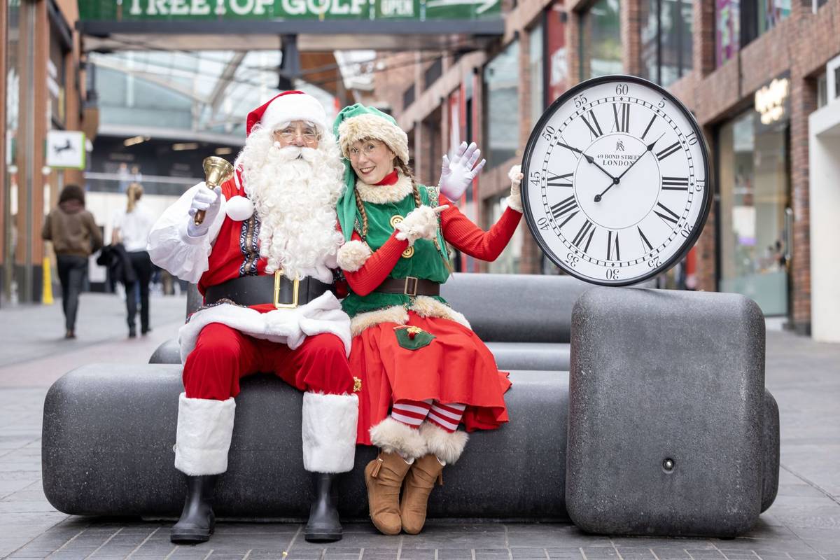 Santa and an elf in Cabot Circus