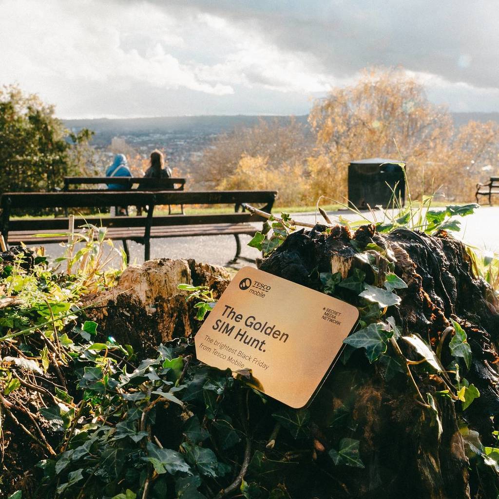 a tesco mobile golden sim card hidden in a scenic viewpoint in bristol by a bench
