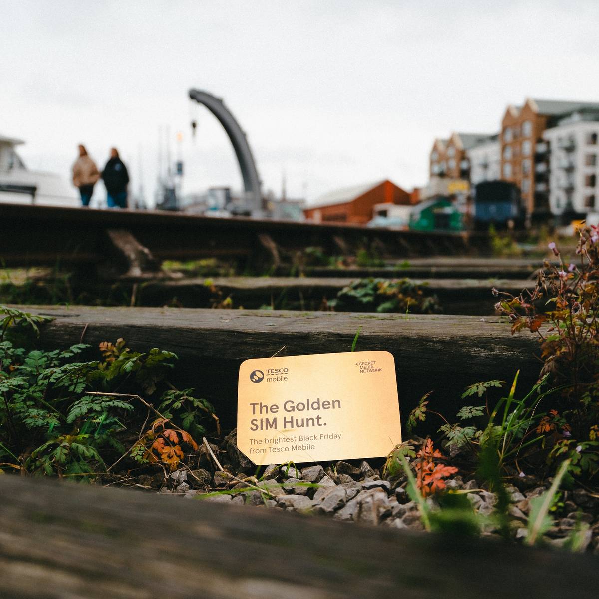 a tesco mobile golden sim card hidden by some steps in bristol