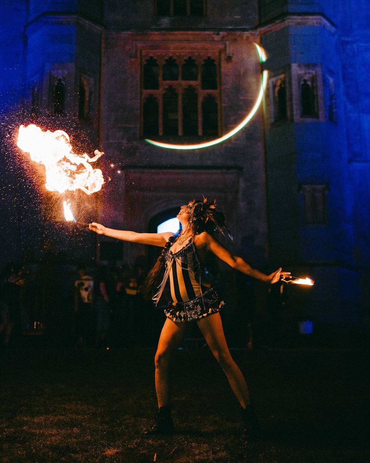 A fire performer outside a Mansion in Bristol