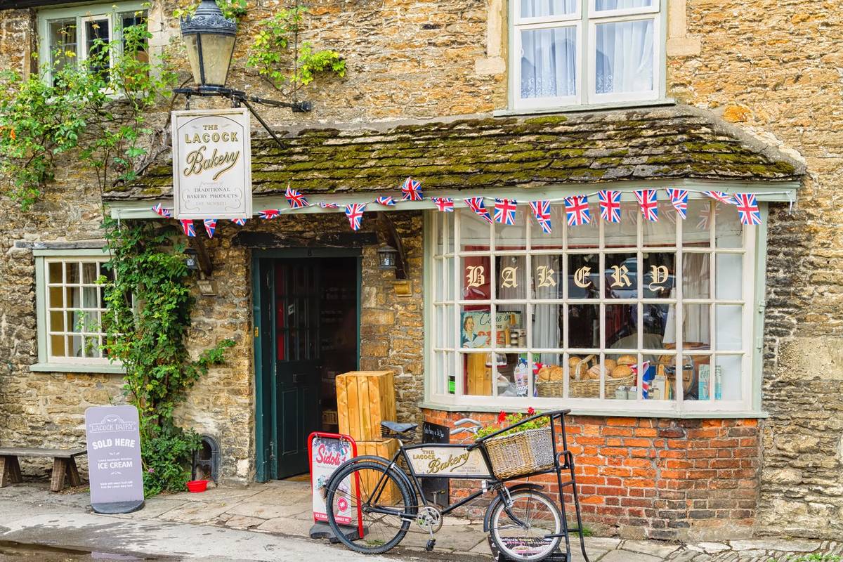 LACOCK, ENGLAND - SEPTEMBER 4, 2016: Old style city of Lacock in The Cotswolds know as Area Of Outstanding Beauty (AONB), England, United Kingdom, Europe