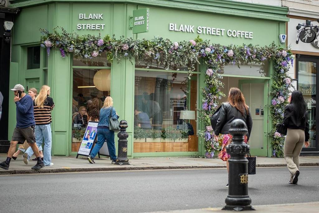LONDON- MAY 23, 2024: Blank Street Coffee shop on Kings Road Chelsea shopping street scene. Landmark street of upmarket shops and restaurants