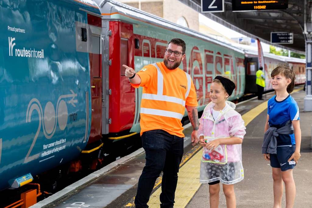 Volunteer-with-children-on-Margate-station-platform-1-scaled