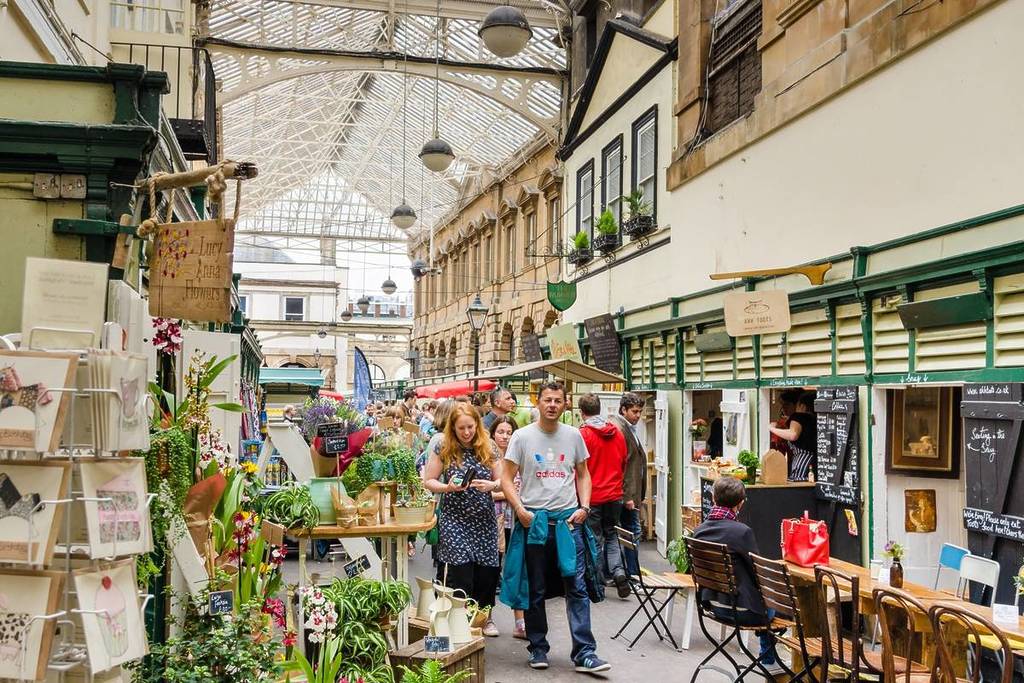 Bristol, UK - June 12, 2015: People strolling around Saint Nicholas Market, Established in 1743 St Nicholas Market is the oldest and best loved market in Bristol.
