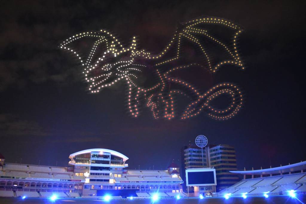 A dragon drone light show in the dark