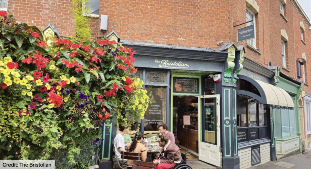 exterior of the bristolian pub with a group outside having drinks