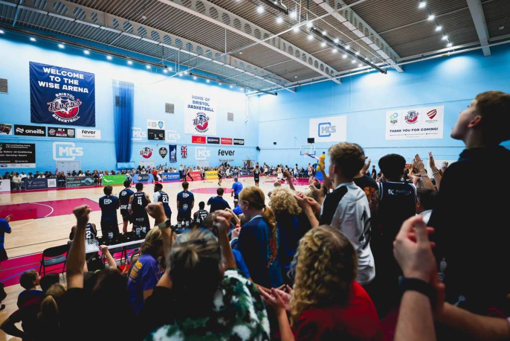 a crowd cheering on basketball team Bristol Flyers on their home court