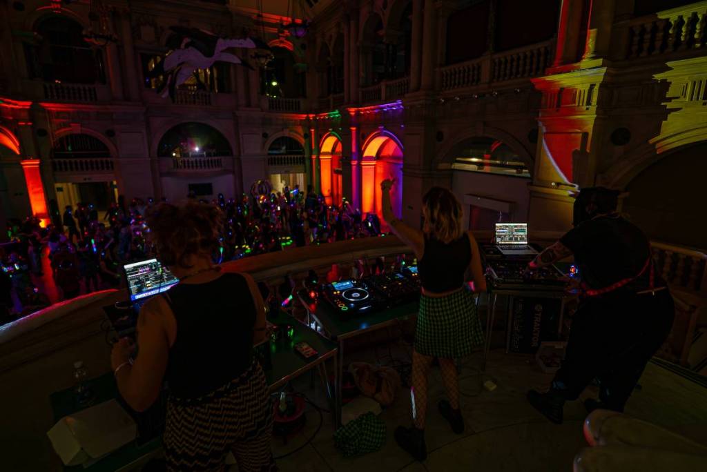 the view into a crowd of dancers at a silent disco from the DJ booth