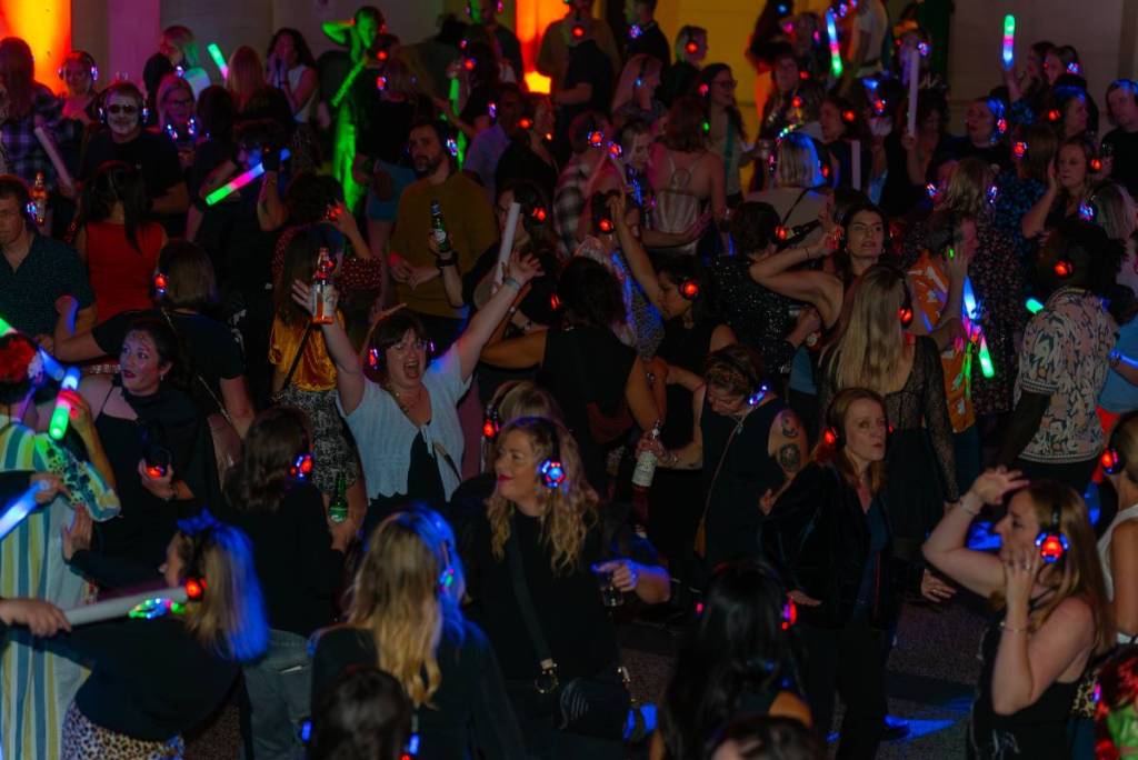 a group of dancers at a silent disco having a good time