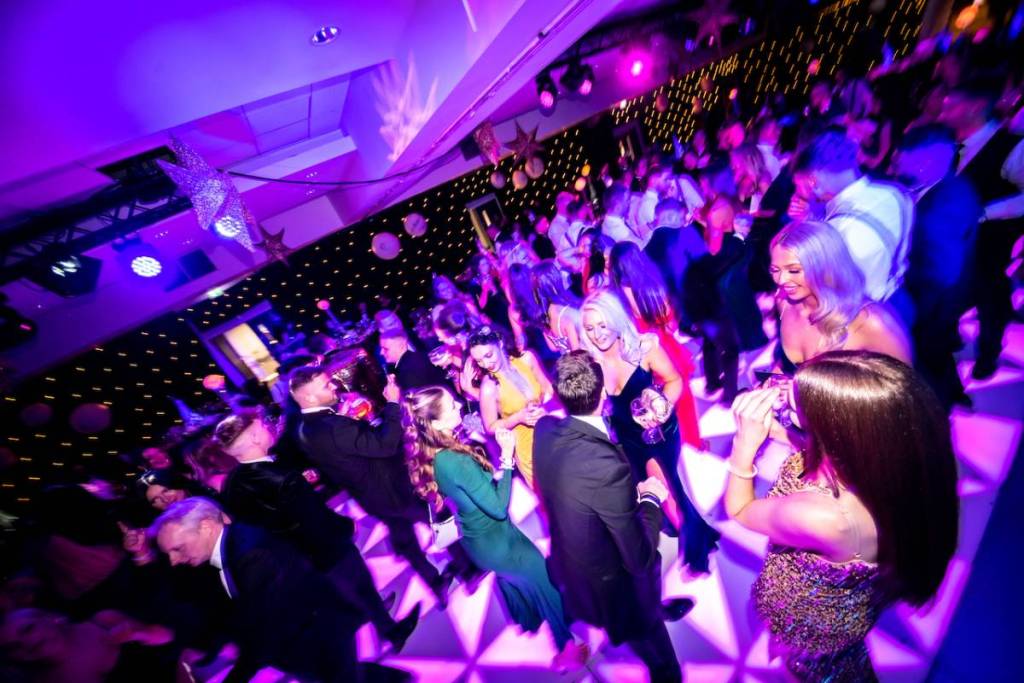 people dancing on the dancefloor at Ashton Gate Stadium