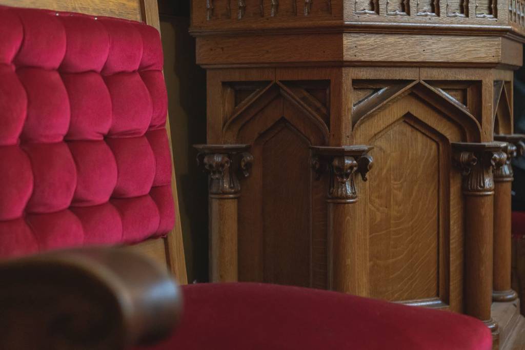 A red velvet chair inside The Lantern Community Church, Calgary.