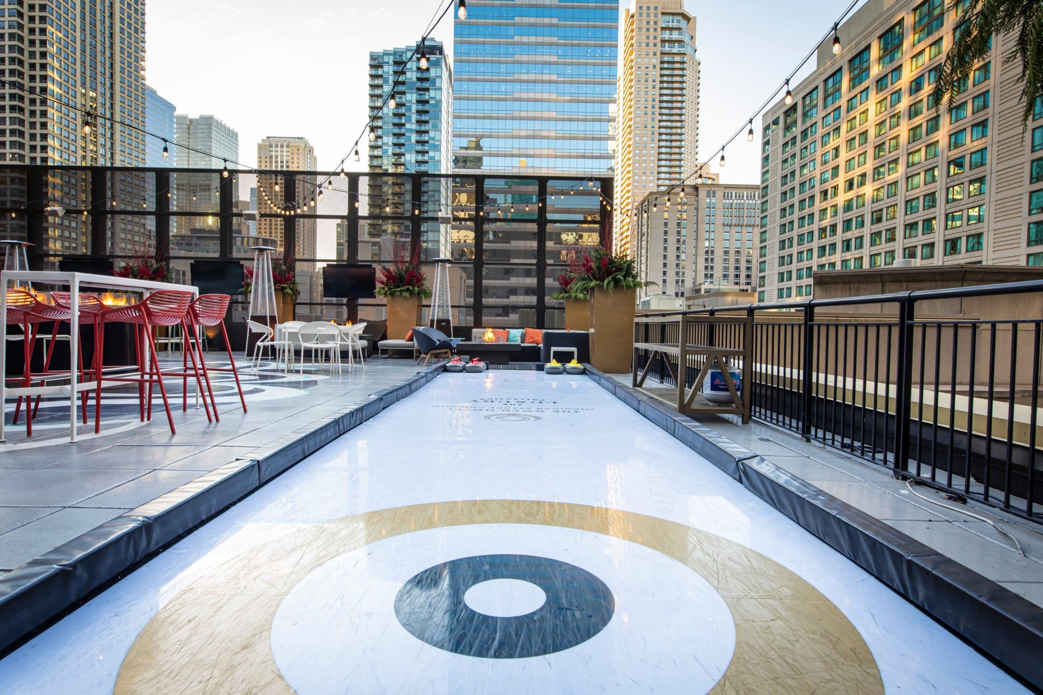 Curling & Cocktails Has Returned To Gwen Hotel's Luxury Rooftop