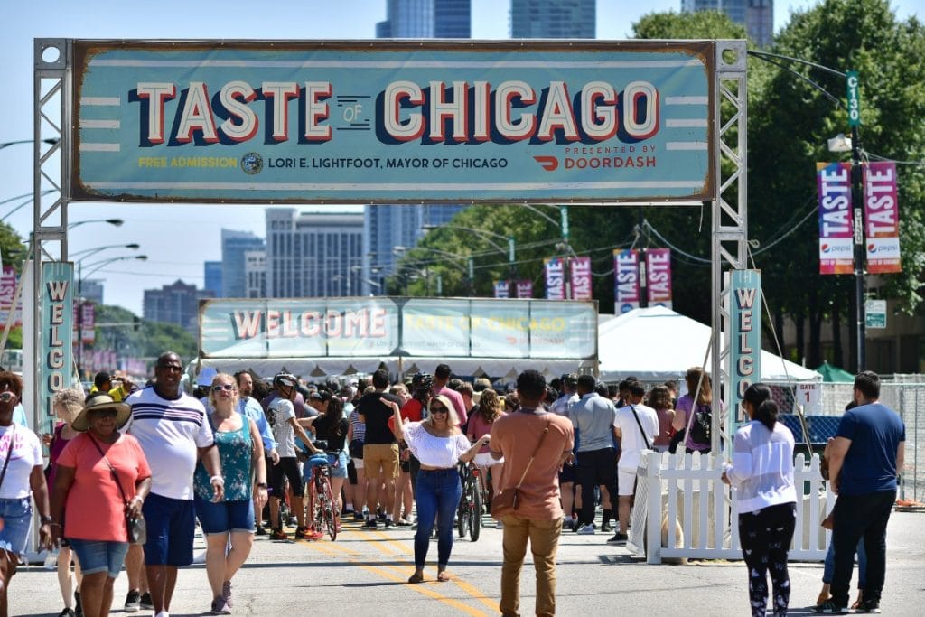 Outdoor food festival featuring welcome banner