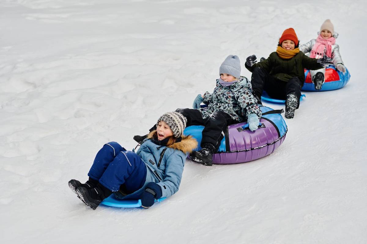 kids tubing in winter