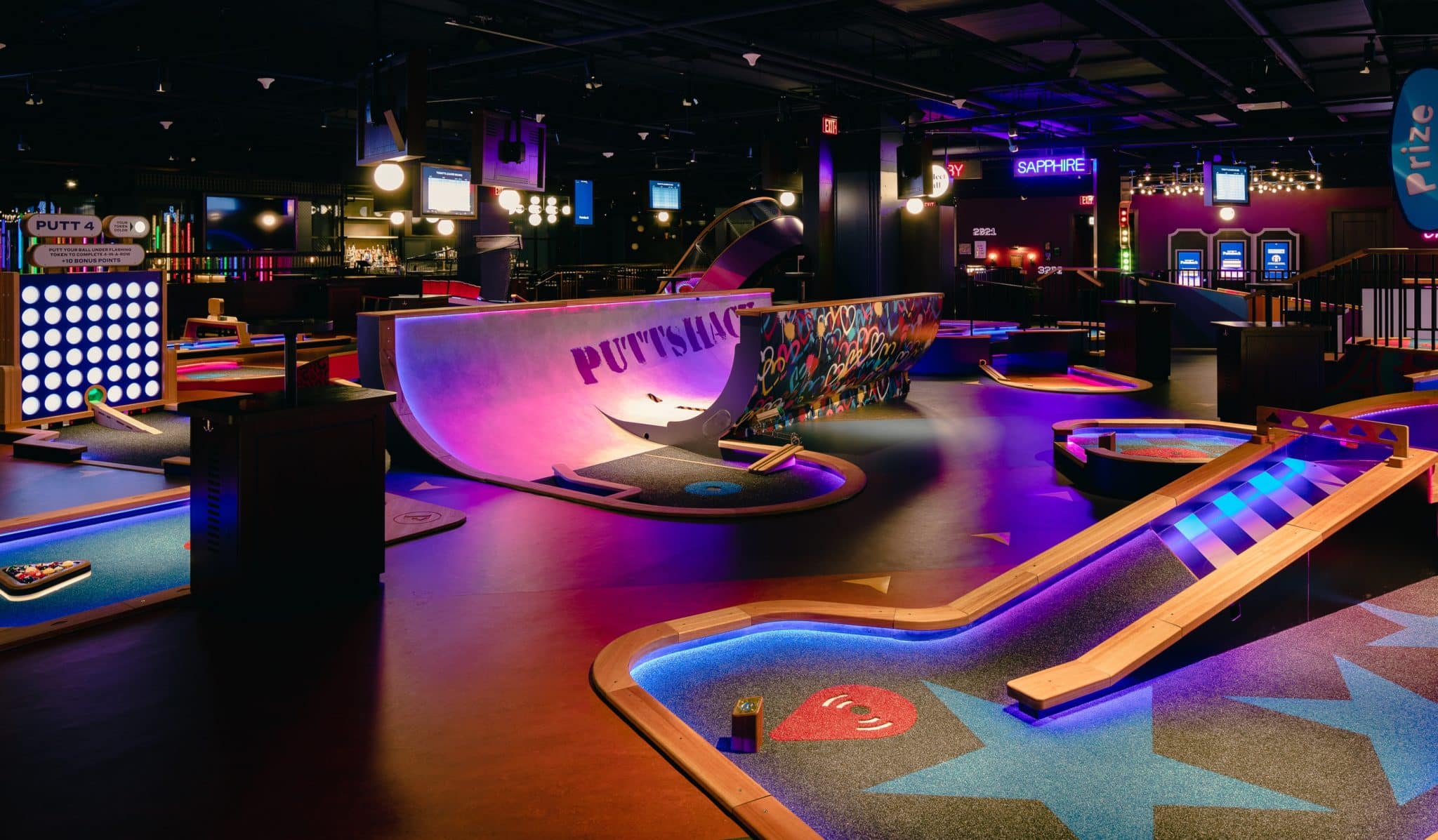 Image showing some of the mini-gold holes and tech-infused obstacles at a Puttshack US location