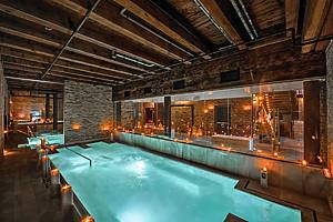 A soothing bath surrounded by candles