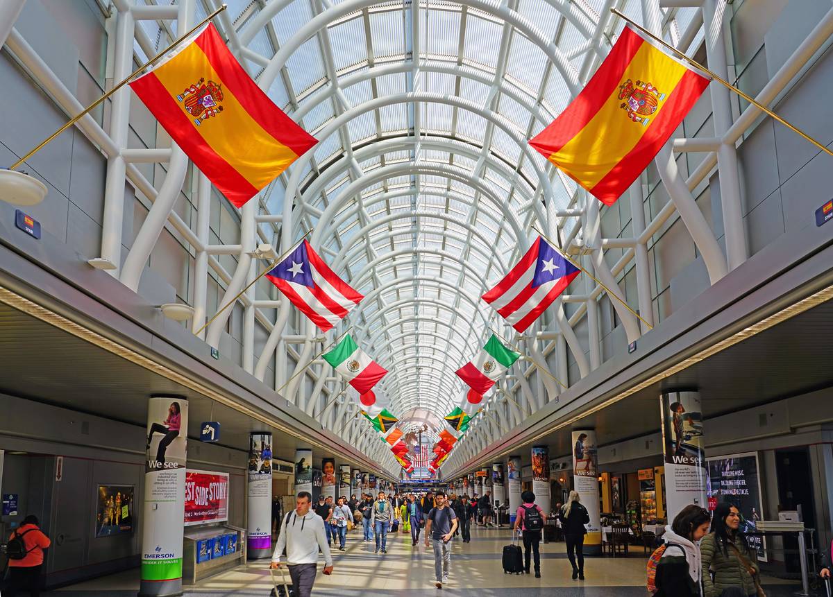 View of the Hall of Flags in Terminal 3 from American Airlines (AA) at Chicago O'Hare International Airport (ORD), a major hub for American and United Airlines.