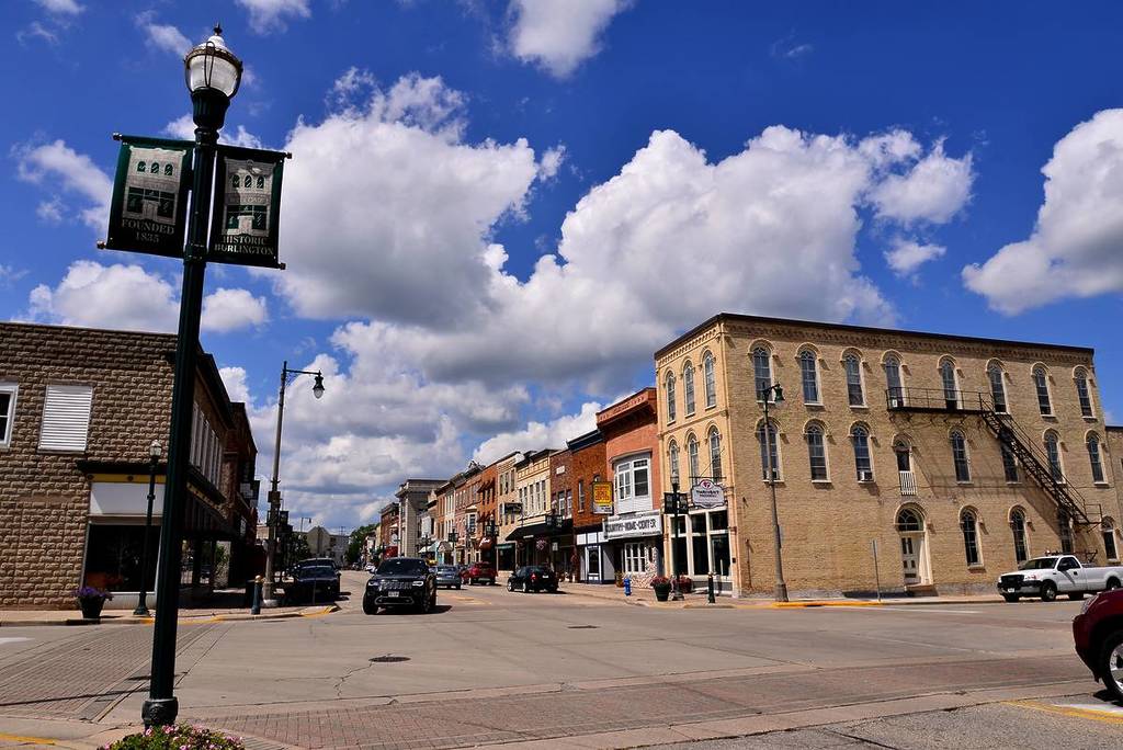 Burlington, Wisconsin / USA - July 29, 2019:  Looking north on a mid summer sunny afternoon with light traffic and a line of the buildings on North Pine Street.