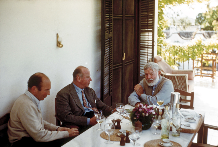 Bill Davis, Rupert Bellville, and Ernest Hemingway dining at La Consula in 1959.