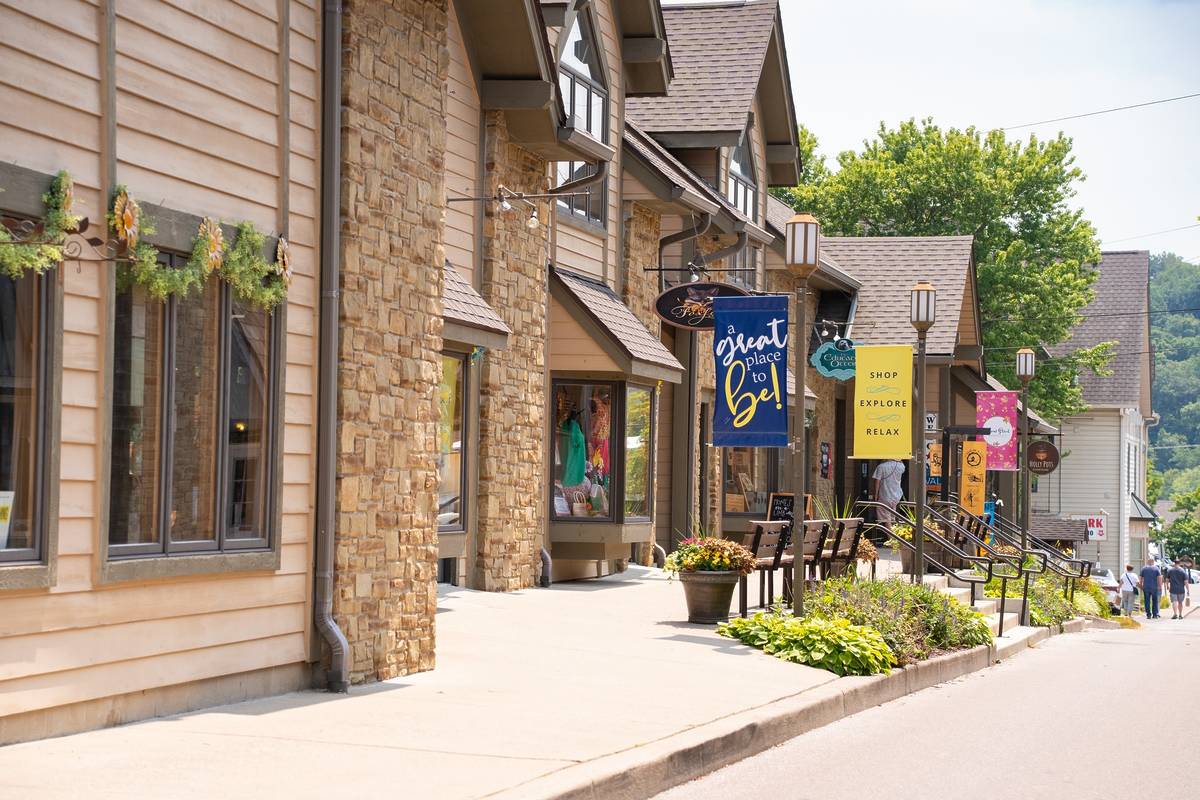 Street scene from historic downtown Nashville Indiana in Brown County with people visible.