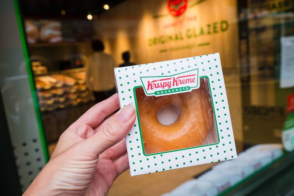 Krispy Kreme Doughnuts shop in London. American multinational doughnut company and coffeehouse chain. Trading as DNUT on the Nasdaq.