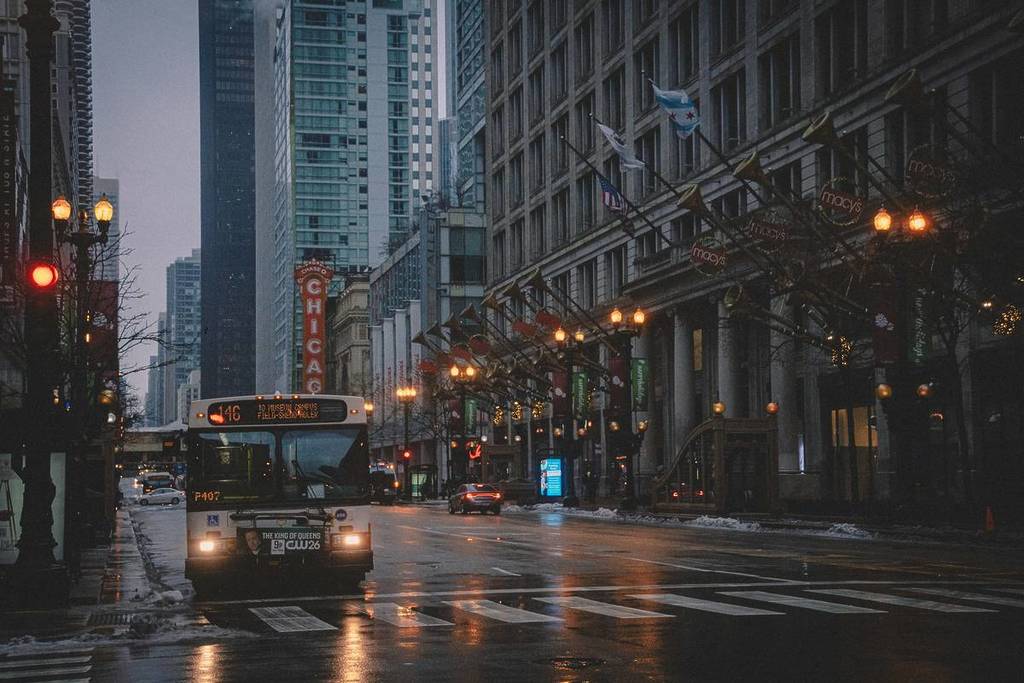 A dark. rainy street in Chicago at night.