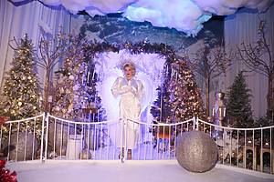 Performers wear holiday costumes