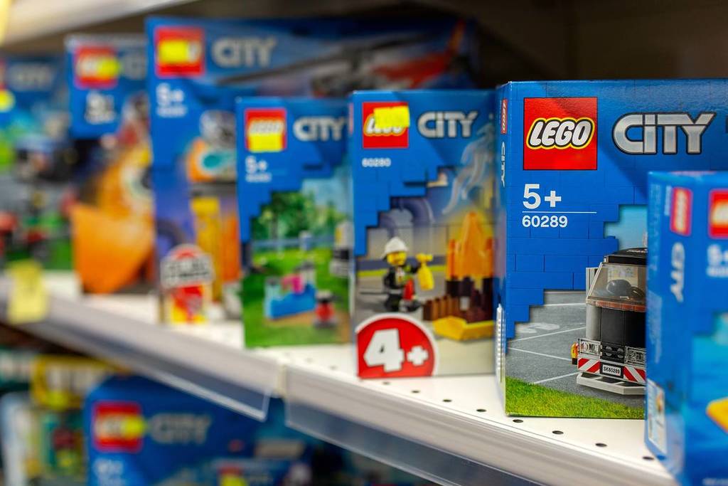 Lego constructors on the shelf of the store. Selective sharpness. Lego is a line of plastic construction toys that are manufactured by Lego Group company