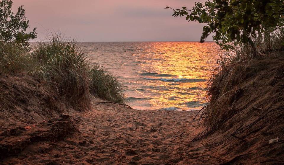 A short drive from Chicago: a picturesque lakeside getaway with a coastal vibe, historic hand-cranked ferry, and breathtaking sunset views