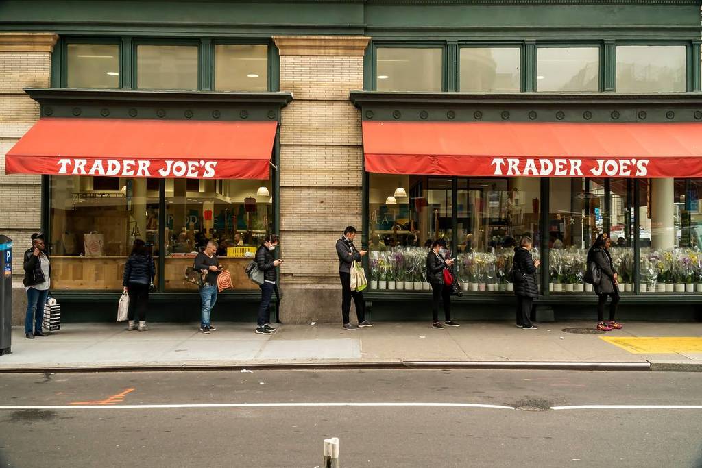 Line of customers outside of TraderJoeÕs in New York as the store limits the amount of shoppers inside