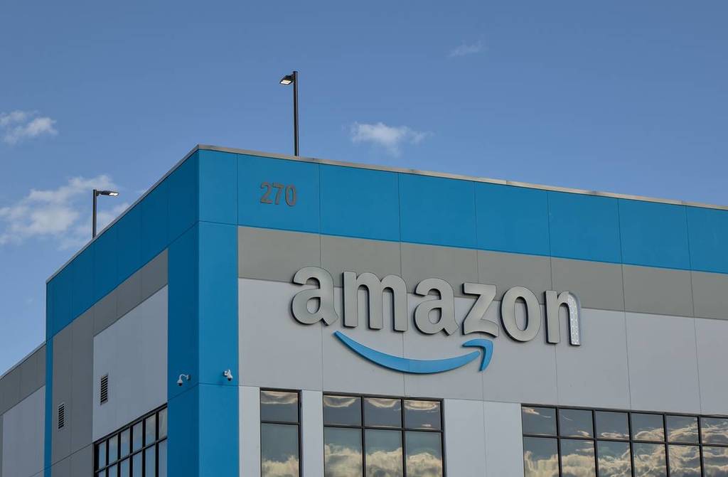 Amazon company logo with damaged letter 'n' on warehouse office building in Red Hook, Brooklyn, New York City.