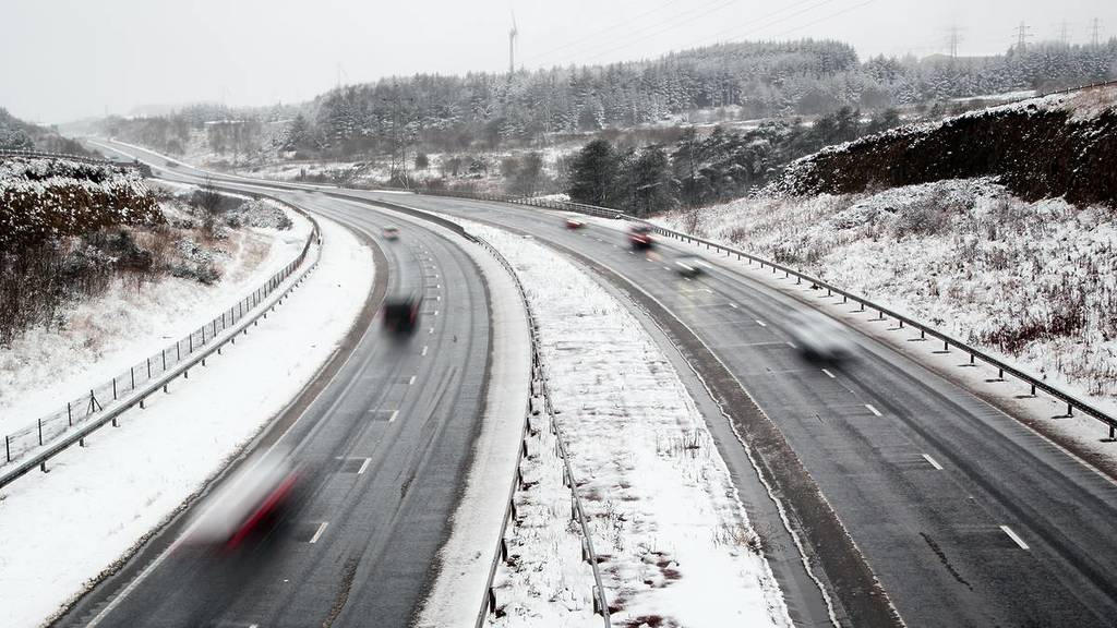 Motion blur long exposure of the A465 road during a winter snow storm