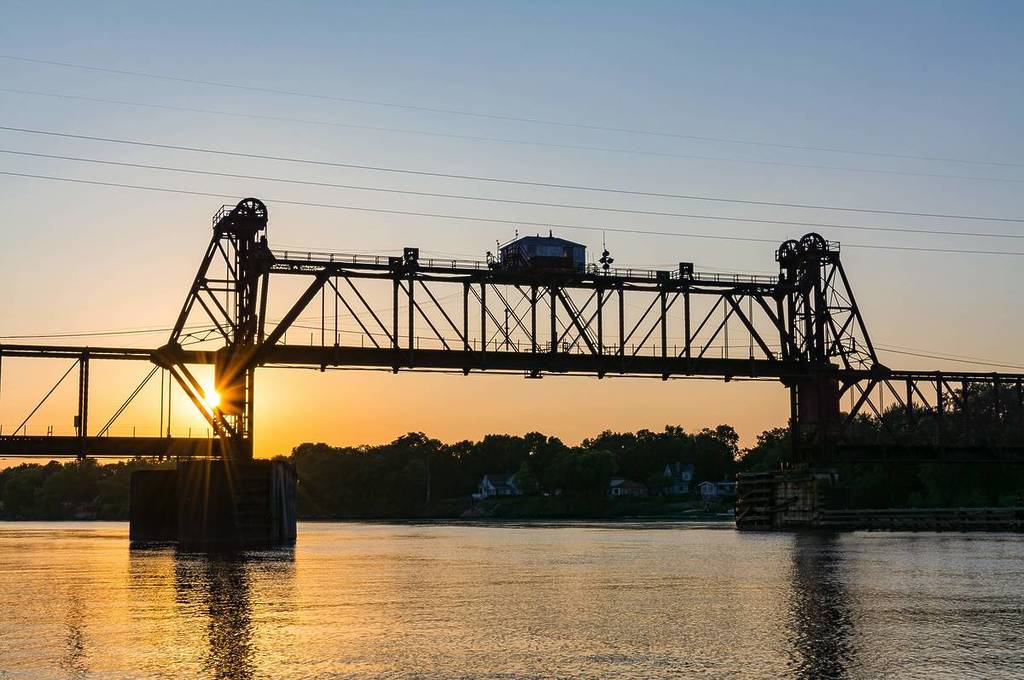 Ottawa Railroad Bridge as the sun sets on the Illinois River. Ottawa, Illinois, USA