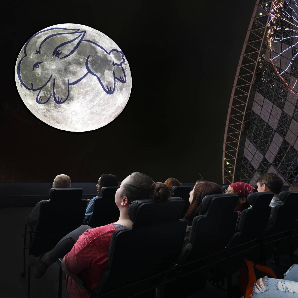 Guests watching Imagine the Moon at the Adler Planetarium