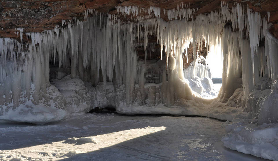 Discover the “Iceland of the Midwest”: Frozen Ice Caves Accessible by a Two-mile Round-Trip Trek on a Frozen Lake