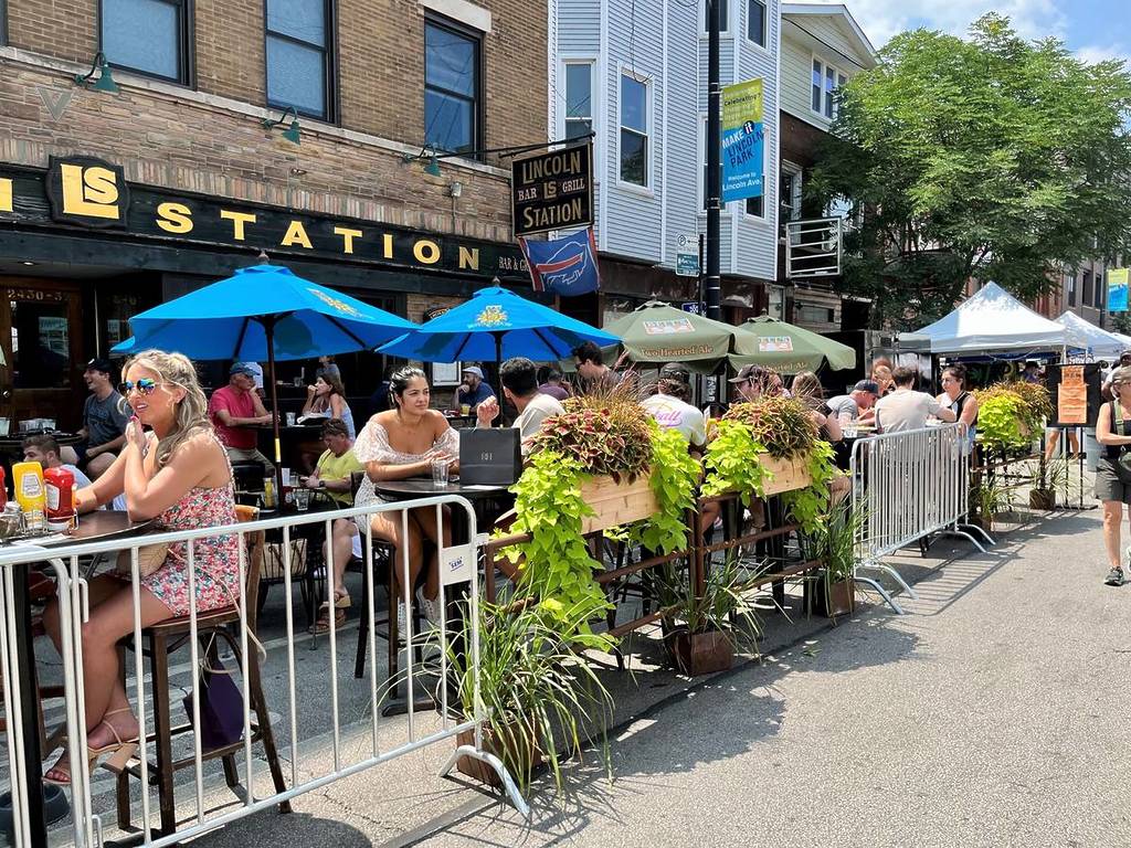 Visitors Dine and Drink at Lincoln Park Fest Street Fair on July 23, 2023 in Chicago. The city hosts a number of summer street fairs each year.