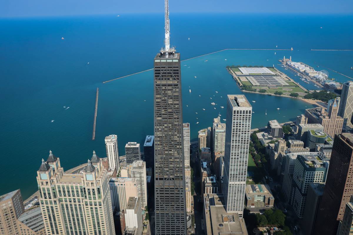 Aerial view of the John Hancock Center (875 North Michigan Avenue) in Chicago, with Lake Michigan and Navy Pier visible.