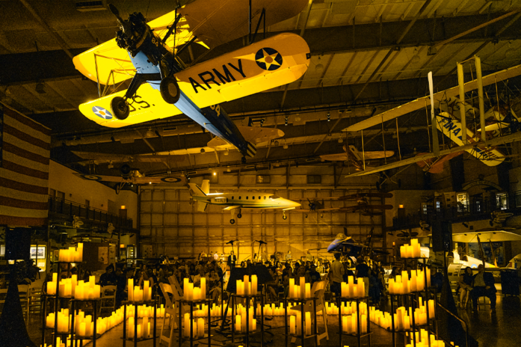 Aircraft above at Frontiers of Flight Museum Dallas while candles flicker