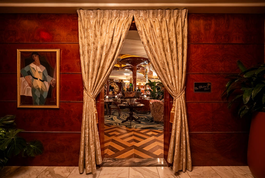 Image shows a curtained entryway into the interior of Delilah Dallas.