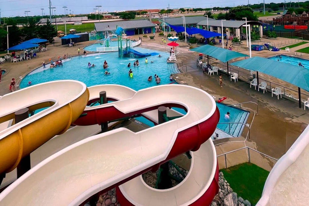 Image shows a slide and pool at Rowlett Wet Zone Waterpark.